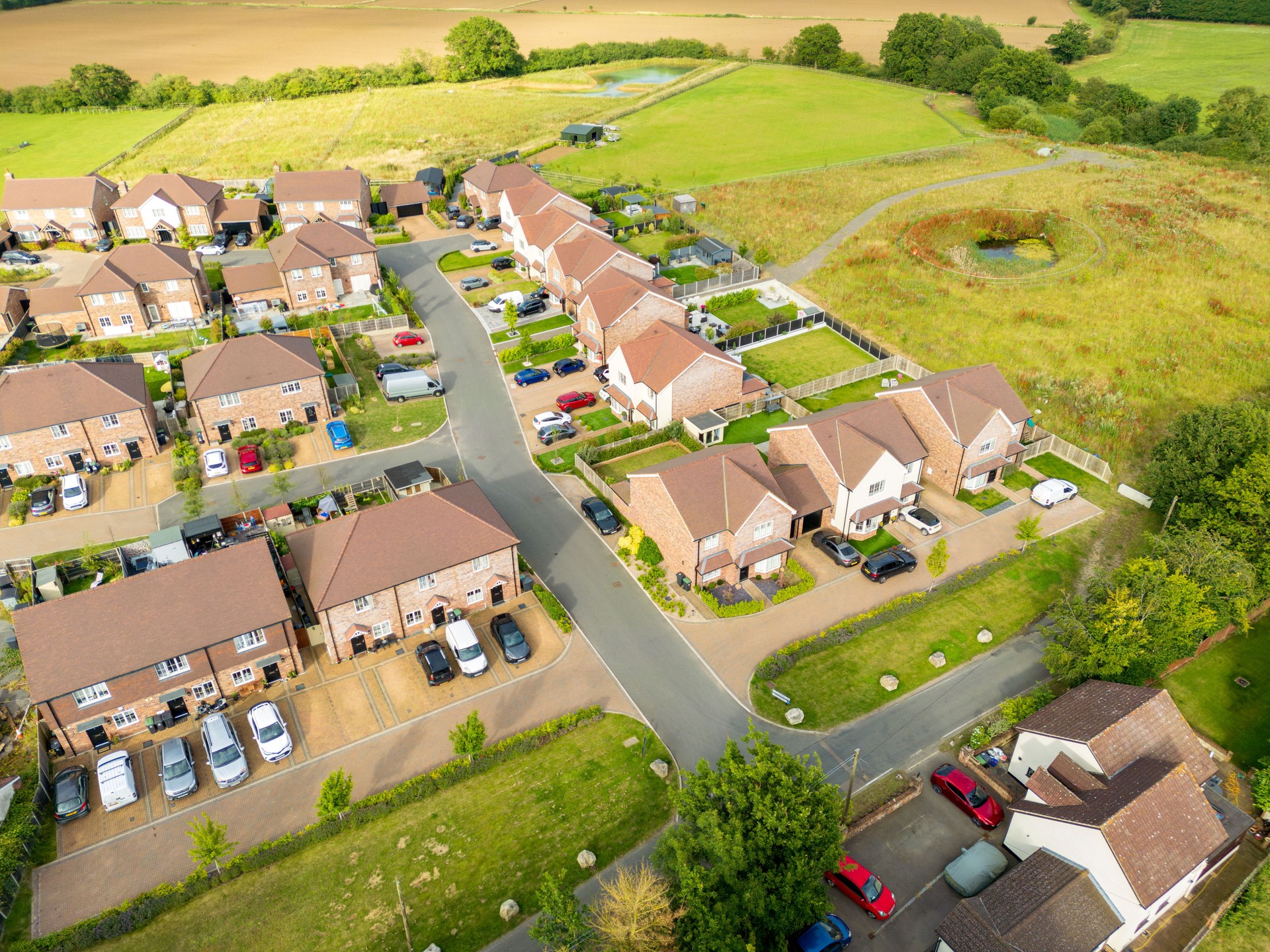 Aerial view of a new housing development on former brown field and agricultural land in rural Essex, UK.